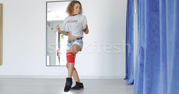 Sportive woman dancing in studio Stock photo © dash