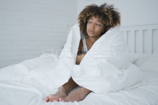 Sad woman wrapping in blanket Stock photo © dash