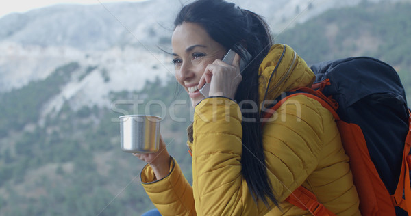 Happy female hiker on phone Stock photo © dash