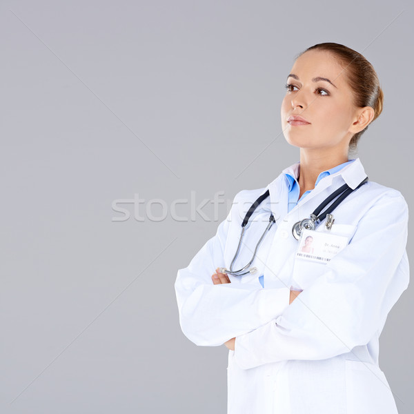 Confident female doctor with crossed arms Stock photo © dash