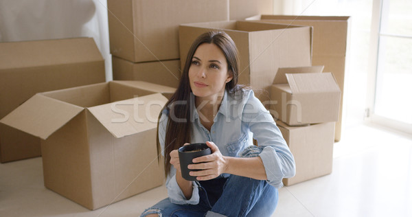 Stock photo: Thoughtful young woman contemplating her new house