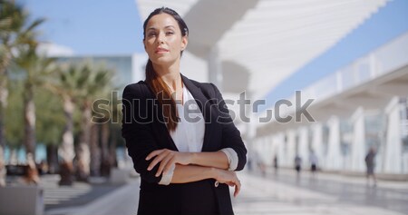 Pretty woman sitting beside a pedestrian walkway Stock photo © dash