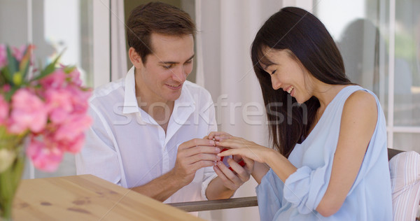 Happy young woman accepting a wedding proposal Stock photo © dash