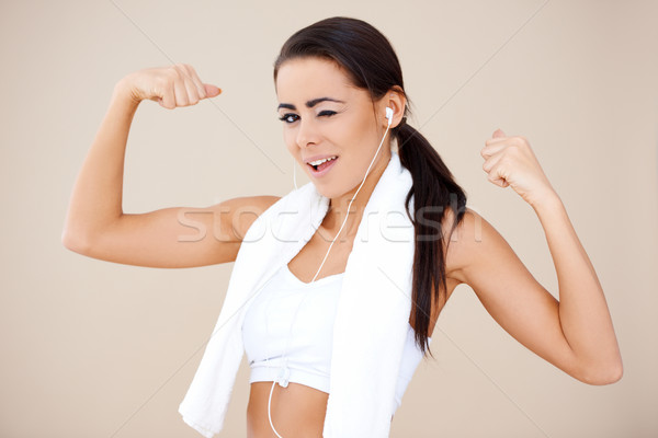 Attractive female showing her biceps Stock photo © dash