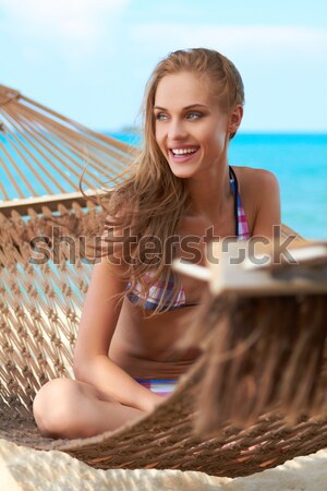Feliz mujer bikini hamaca sesión amplio Foto stock © dash