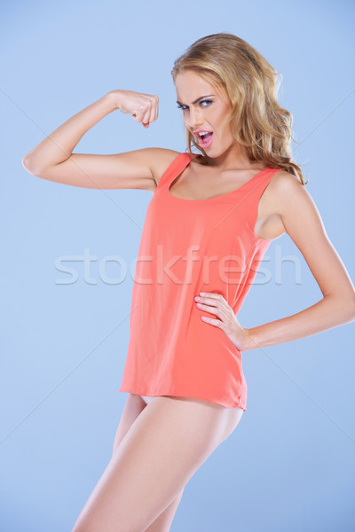 Spoof image of a woman flexing her muscles Stock photo © dash