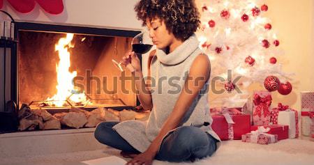 Chic young woman typing a Christmas message Stock photo © dash