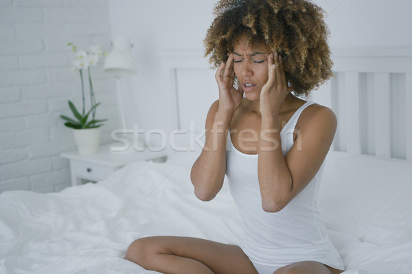 Woman suffering from headache Stock photo © dash