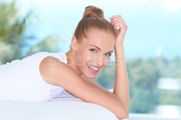 Beautiful high-spirited woman laughing Stock photo © dash