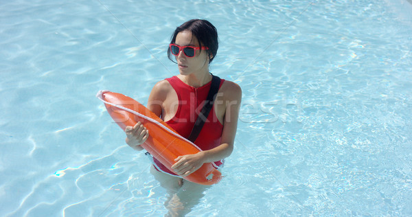 Lifeguard walking through shallow water Stock photo © dash