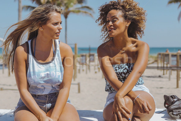 Relaxed women spending time on shoreline Stock photo © dash