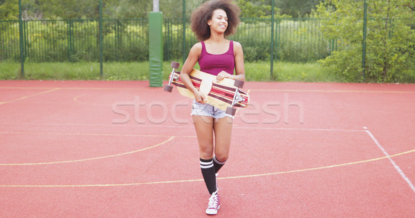 Sportive woman with longboard Stock photo © dash