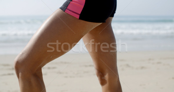 Woman's Fit Legs On A Beach Stock photo © dash