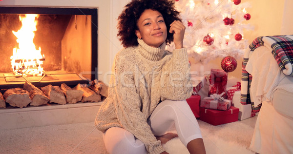 Woman by fireplace and white christmas tree Stock photo © dash