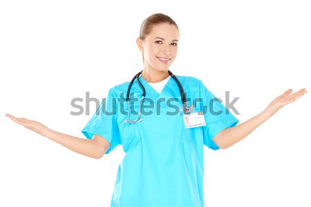 Smiling woman doctor raising her hands Stock photo © dash