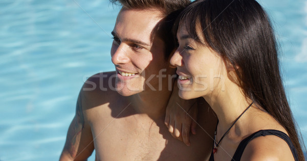 Napozás pár ül vmi mellett úszómedence élvezi Stock fotó © dash