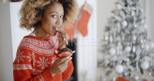 Attractive young woman eating Christmas cake Stock photo © dash