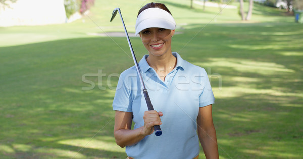 Sonriendo amistoso mujer golfista caminando campo de golf Foto stock © dash