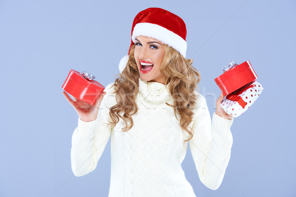 Sexy woman in Santa hat trying to decide which gift Stock photo © dash