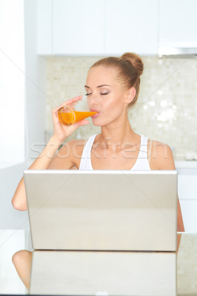 Healthy woman using laptop Stock photo © dash