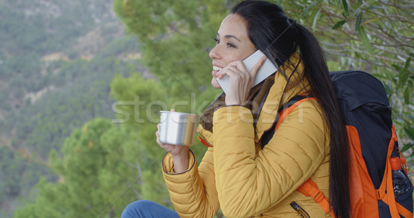 Happy female hiker on phone Stock photo © dash