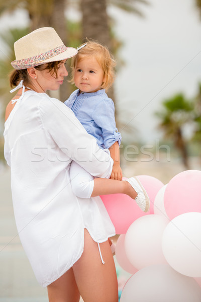 Trendy mother with a baby daughter Stock photo © dash