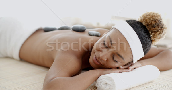 Woman Getting Hot Stones Massage At Spa Stock photo © dash