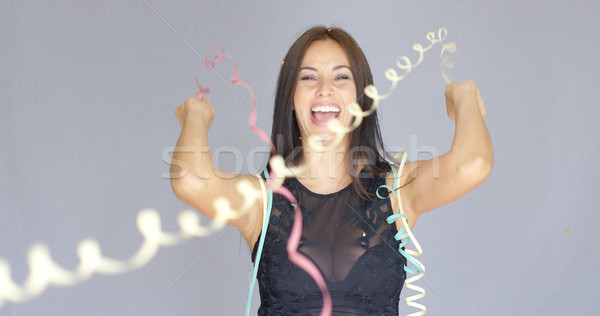 Vivacious laughing woman enjoying a party Stock photo © dash