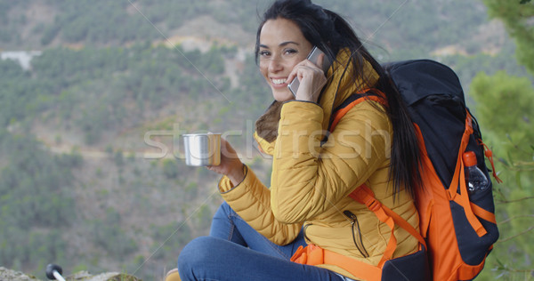 Happy female hiker on phone Stock photo © dash