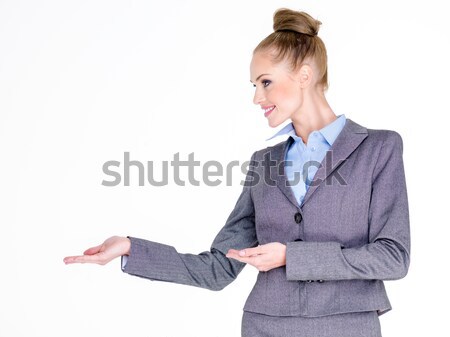 Businesswoman Holding Hands Out to Side Stock photo © dash