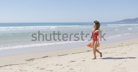 Female with flippers standing on beach Stock photo © dash