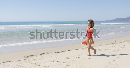 Stock photo: Female with flippers standing on beach