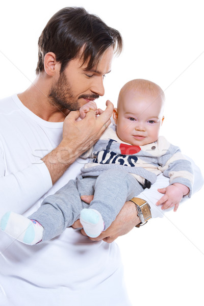 Young father cradling his baby on his arm Stock photo © dash