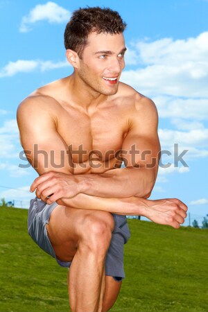Fitness man doing expand exercises in park Stock photo © dash