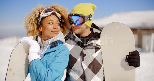 Affectionate young couple posing with snowboards Stock photo © dash