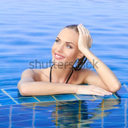Sexy piscina mujer sonriente borde agua nina Foto stock © dash
