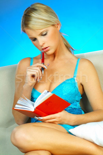 Blonde woman with datebook Stock photo © dash