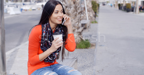 Trendy chic young woman listening to a mobile call Stock photo © dash