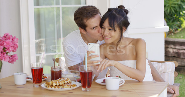 Happy mixed race couple taking selfie Stock photo © dash