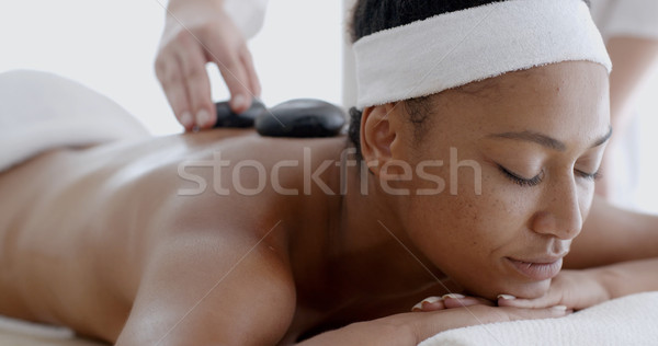 Woman Receiving A Massage With Hot Stone Stock photo © dash