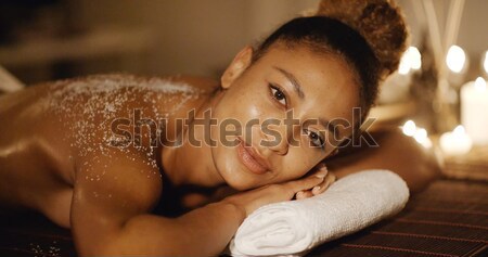 Woman Lying On Massage Table With Salt Scrub Stock photo © dash