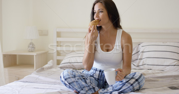 Attractive young woman having her breakfast Stock photo © dash