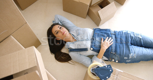 Attractive young woman relaxing on the floor Stock photo © dash