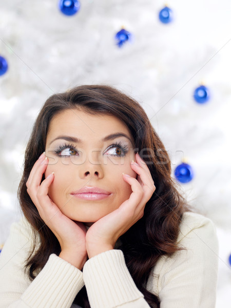 Thoughtful woman in front of a Christmas tree Stock photo © dash