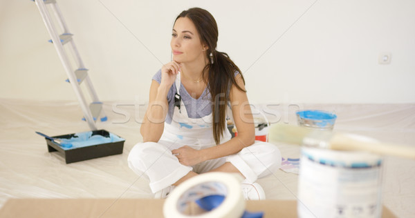 Thoughtful young woman renovating a house Stock photo © dash
