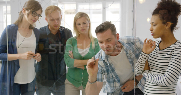 Interested colleagues taking part in work process Stock photo © dash