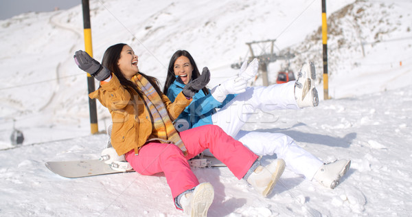 Two happy young women enjoying a winter holiday Stock photo © dash