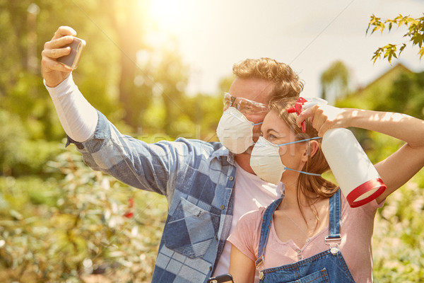 Gardeners taking selfie with respirator Stock photo © dash