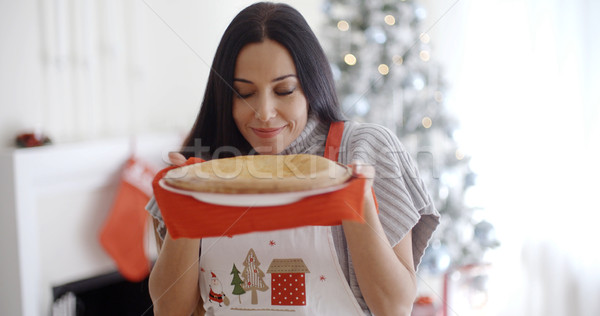 Stock photo: Attractive young woman baking tarts for Xmas