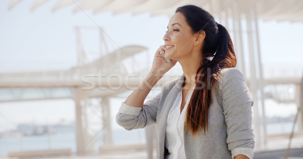 Woman using a mobile in a high key environment Stock photo © dash